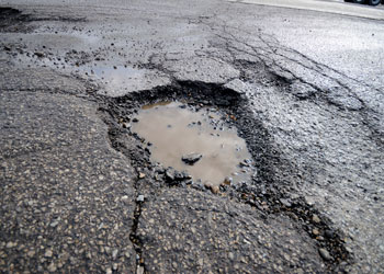 Why Asphalt Driveways Pothole in the Winter Grand Rapids Asphalt Paving